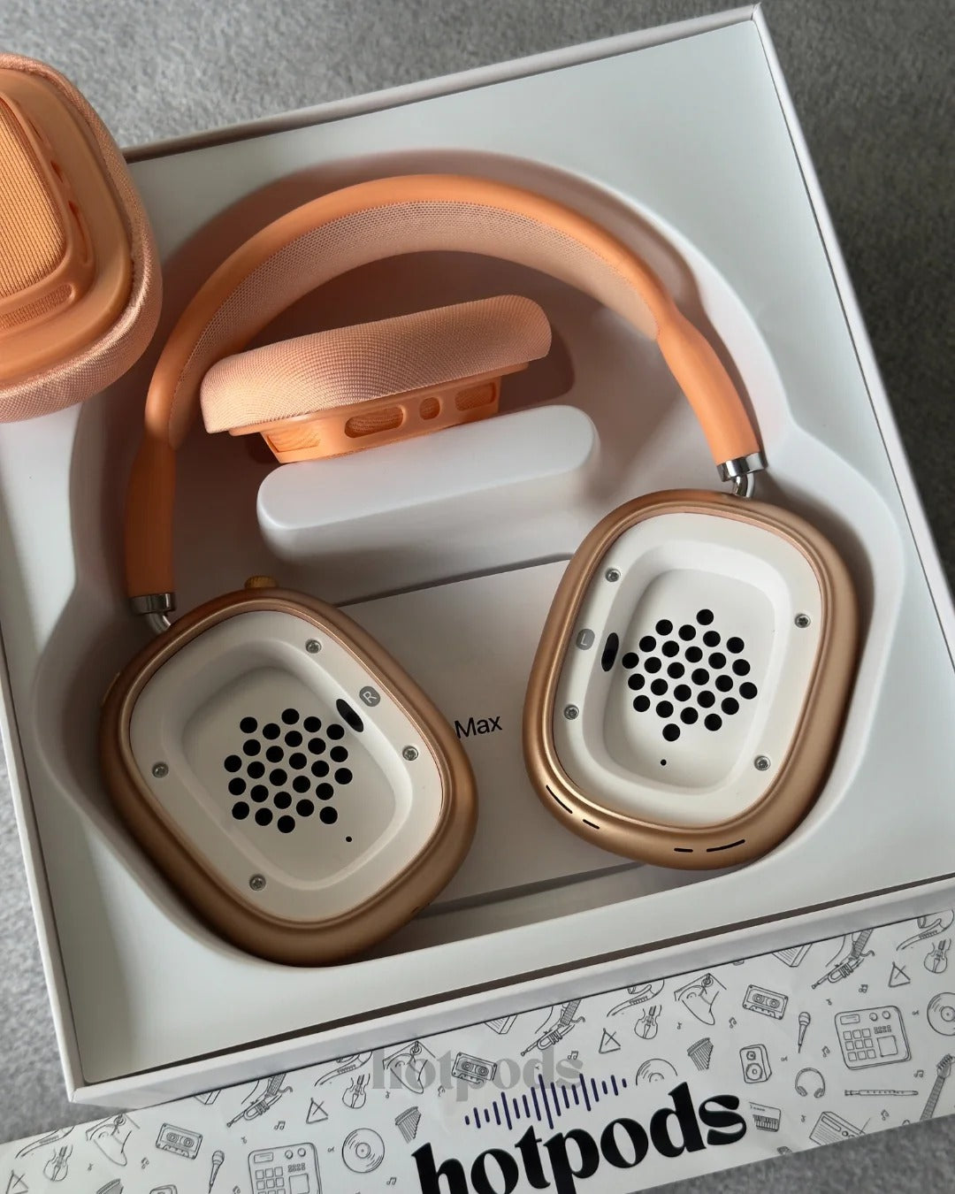 Pair of headphones with a white box featuring the brand 'hotpods'.